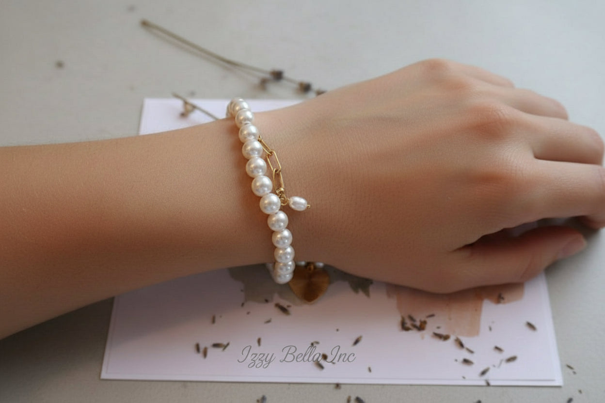 Freshwater pearl gold heart charmed bracelet
